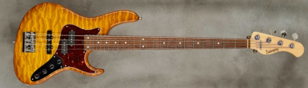 Model 4-24 Vintage
Serial #6625
Finish Caramel Burst
Body Chambered Alder with Quilt Maple Top
Weight 8.10 lbs
Neck Maple with thin matte nitro finish
Radius/Nut 12" radius, 1.5" nut width
Fingerboard Madagascar Rosewood
Pickguard Tortoise
Hardware Chrome with Drop D Tuner
Pickups Sadowsky P/J
Preamp Sadowsky preamp with vintage tone control