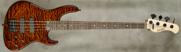 MODEL: 4-24 Modern,
SERIAL: #8147,
FINISH: Tiger Eye
BODY: Chambered Alder, w/Quilt Maple Top
WEIGHT: 8.7,
NECK: Maple with thin matte nitro finish,
FINGERBOARD: Amazon Rosewood, 9″ radius, 1.45″ nut width,
PICKGUARD: None,
HARDWARE: Black,
PICKUPS: Sadowsky soapbar,
PREAMP: Sadowsky preamp with vintage tone control