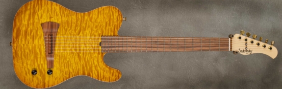 Model Electric Nylon Guitar
Serial #9157
Finish Caramel Burst
Body Chambered Alder w/ Quilt Maple Top
Weight 5.78 lbs
Neck Maple with thin matte nitro finish
Radius/Nut 12" radius, 1 7/8" nut width
Fingerboard Morado
Pickguard None
Hardware Gold
Pickups Custom Barbera Pickup
Preamp Sadowsky buffer preampÂ