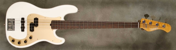 Model 4-20 P4,
Serial #9183,
Finish White Pearl,
Body Chambered Alder,
Weight 7.72 lbs,
Neck Roasted Flame Maple with thin matte nitro finish,
Radius/Nut 12" radius, 1.5" nut width,
Fingerboard Brazillian Rosewood,
Pickguard Anodized Gold,
Hardware Chrome ,
Pickups Sadowsky P/J,
Preamp Sadowsky preamp with vintage tone control