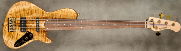 Model 5-24 Single Cut Vintage.
Serial #9352
Finish Natural
Body Chambered Okoume w/ Koa Top
Weight 8.86 lbs
Neck Maple with thin matte nitro finish
Radius/Nut 12" radius, 1 3/4" nut width
Fingerboard Amazon Rosewood w/ White Pearloid dots
Pickguard Plexi
Hardware Gold
Pickups Sadowsky Humcancelling J/Super J
Preamp Sadowsky preamp with vintage tone control and Mid Boost